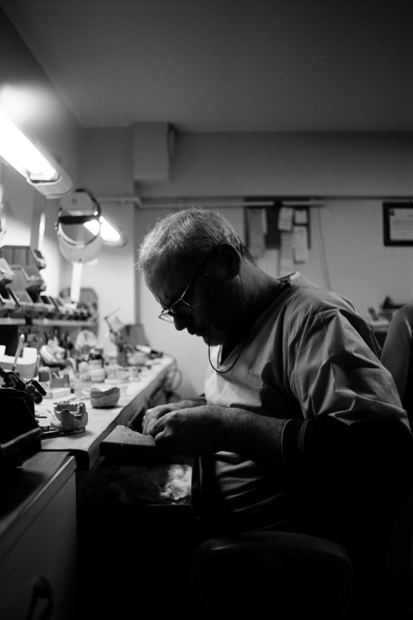 Dental technician working at the laboratory bench